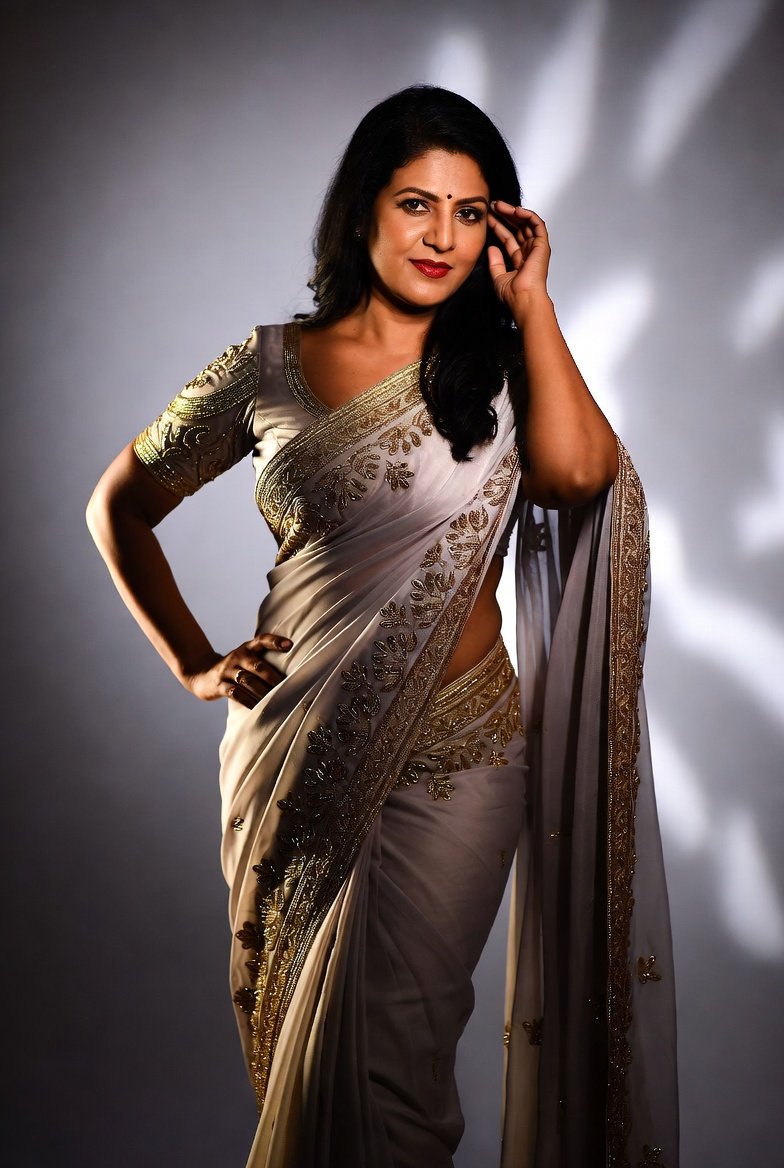 Confident Indian bhabhi in silver saree with magnetic smile