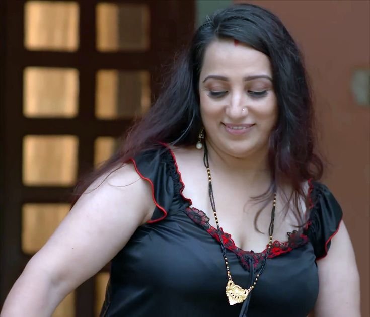 Beautiful Indian bhabhi in stylish black top smiling