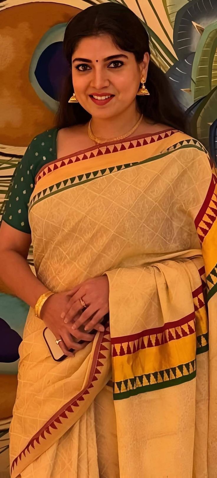 Lovely Indian aunty in yellow saree with a warm smile