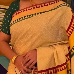 Lovely Indian aunty in yellow saree with a warm smile