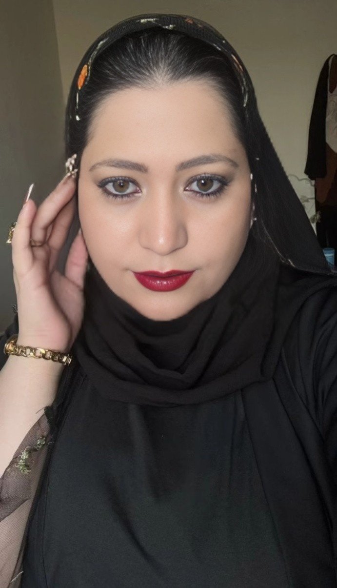 Beautiful Indian woman wearing hijab and jewelry posing for portrait