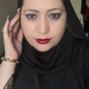 Beautiful Indian woman wearing hijab and jewelry posing for portrait