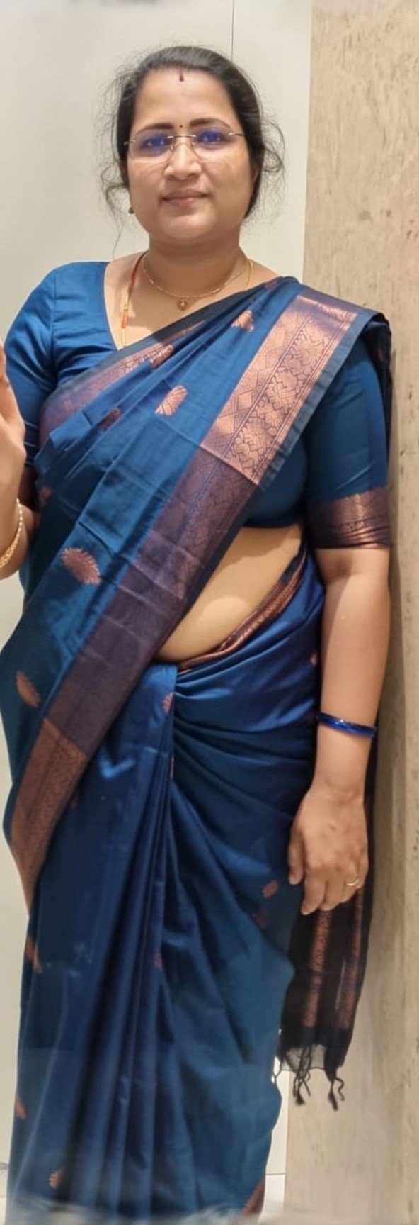 Voluptuous Indian aunty in blue saree posing confidently