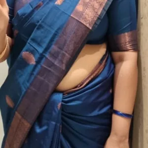 Voluptuous Indian aunty in blue saree posing confidently