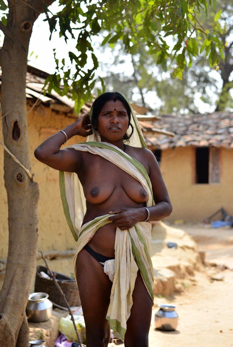 Curvy Indian bhabhi with saree loose posing outdoors in village setting