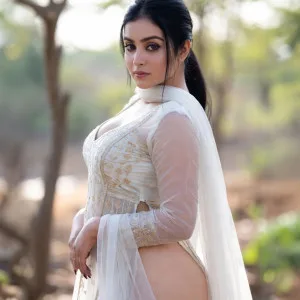 Desi aunty in sheer white lehenga posing outdoors