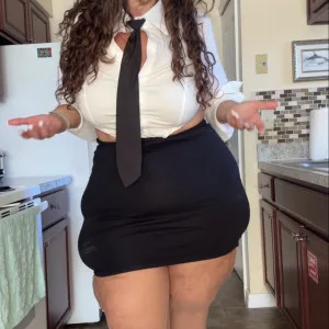 thin aunty confidently strides in her workspace with white shirt and black skirt