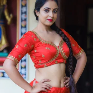 Radiant Indian Beauty in Vibrant Red Ensemble