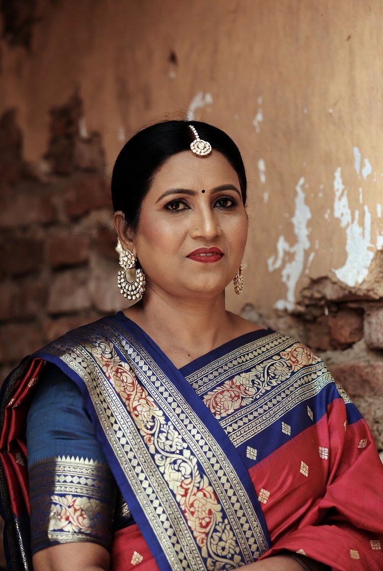 Beautiful Indian aunty in blue and red saree with jewelry