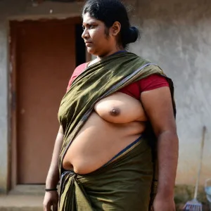 Voluptuous Indian bhabhi in green sari outdoors