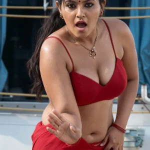 Bold bhabhi in red saree top and skirt posing outdoors