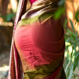 Saree fabric accentuating elegant curves in a lush garden setting