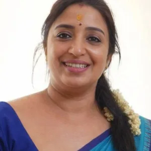 Voluptuous Indian aunty in blue saree smiling broadly